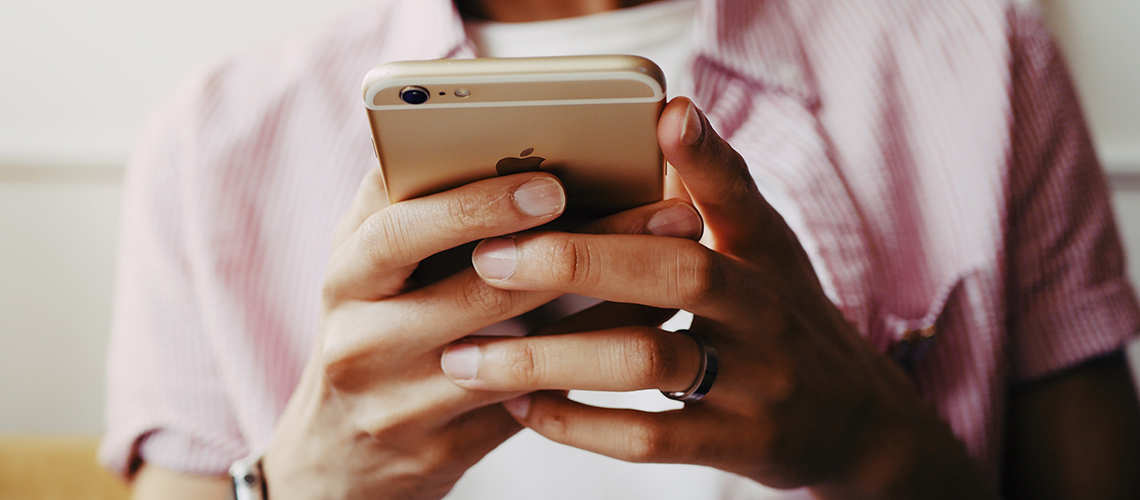 Hand holding mobile phone