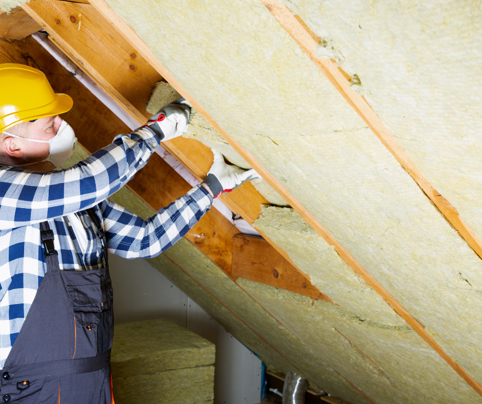 a worker installing insulation