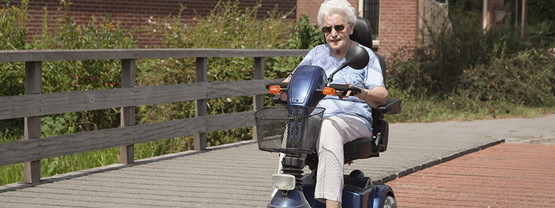 Lady using a mobility scooter