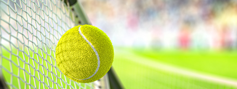 Tennis ball hitting racket