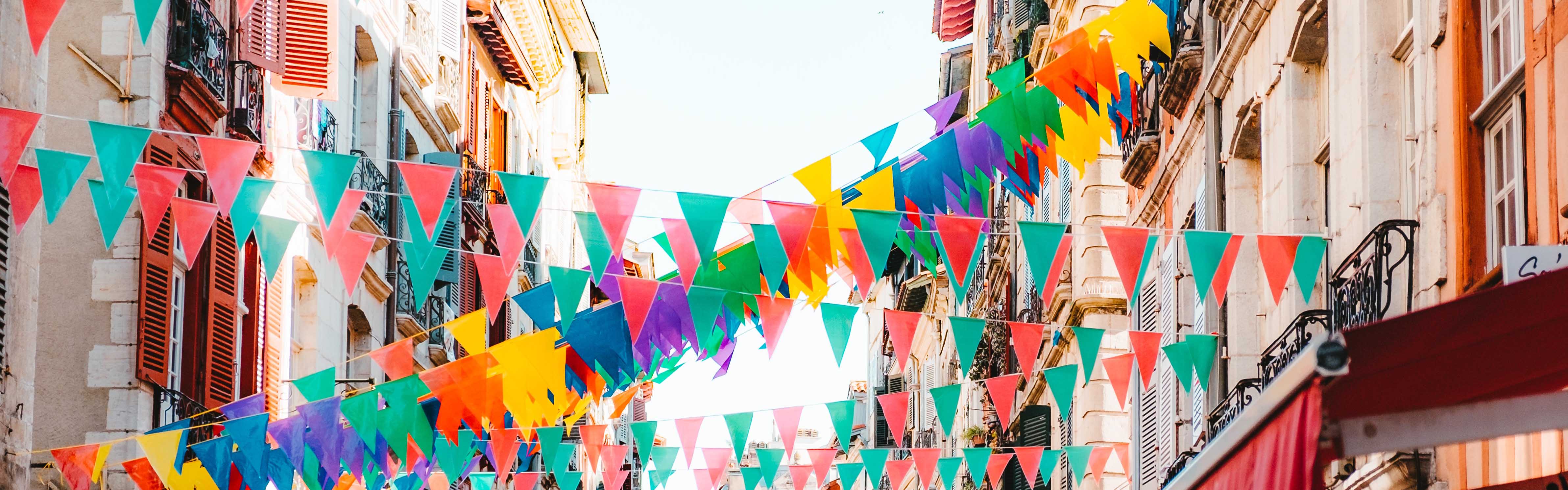 Bunting across the street with colourful flags