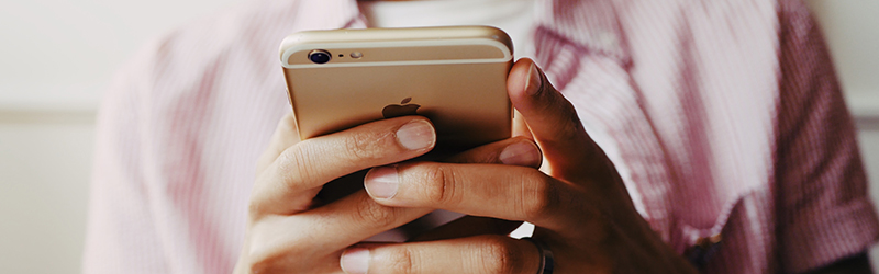 Hands holding a mobile phone