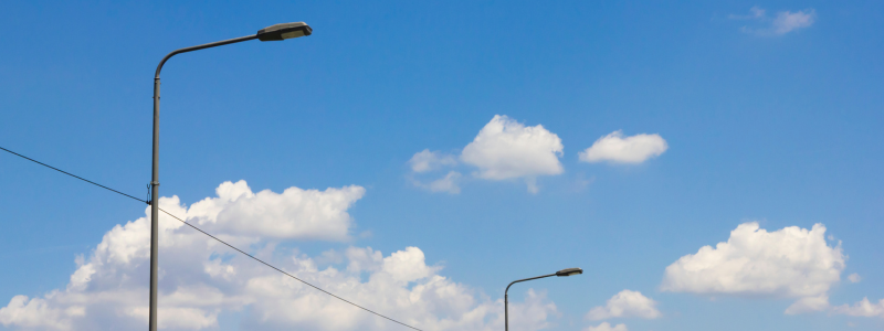Street light blue sky and clouds